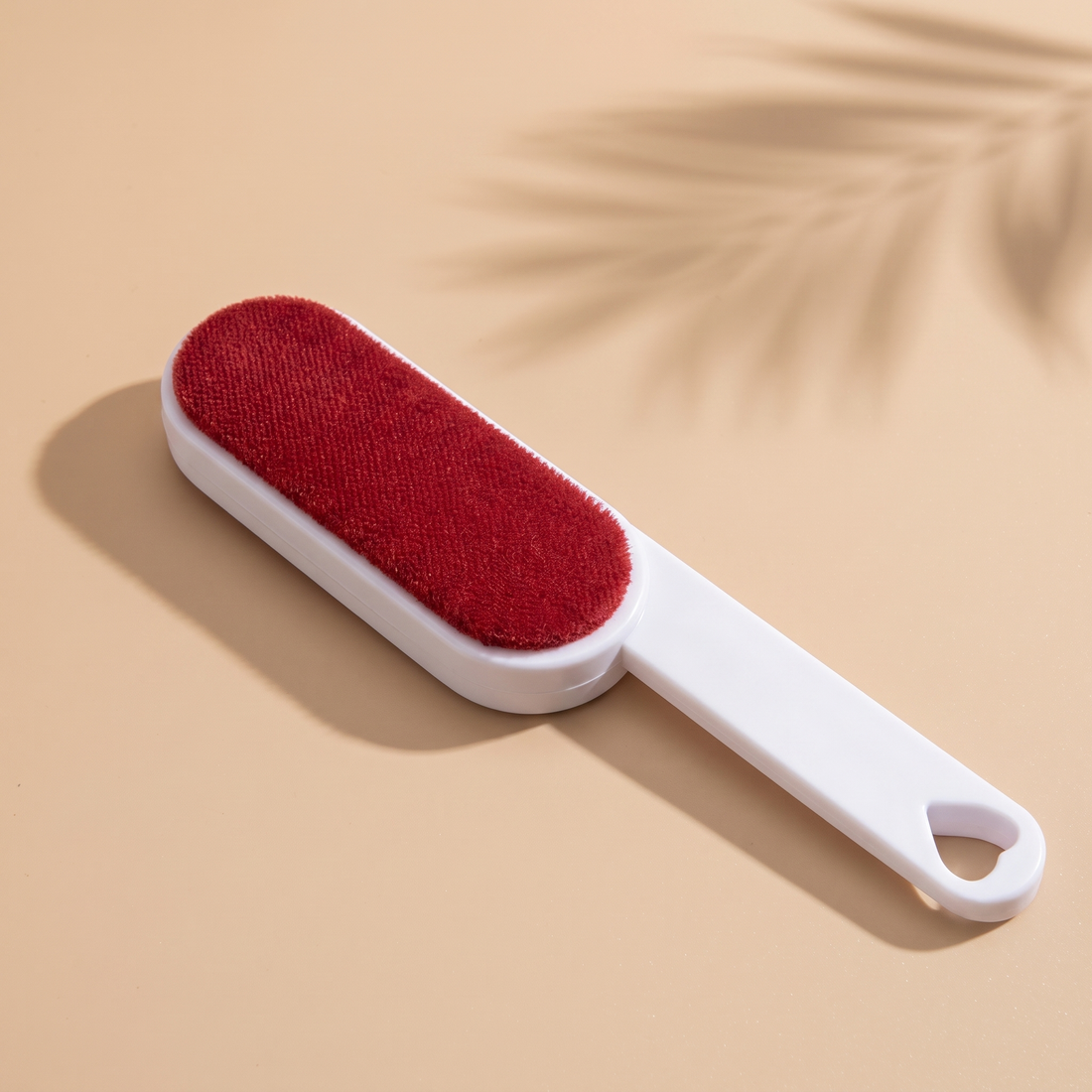 Furlet Self-Cleaning Hair Brush on a warm beige studio background